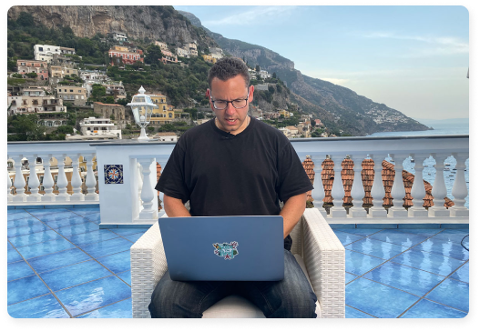 Timothy Sykes Working on Laptop